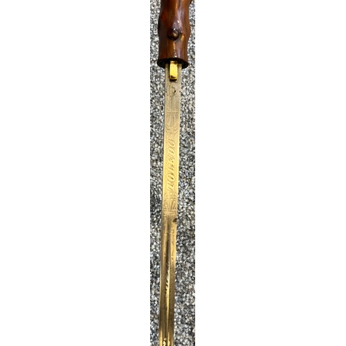 825 - Antique walking cane fitted with a hidden Toledo engraved sword. Horn handle and white metal collar.... 