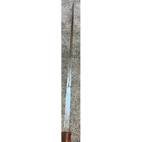 825 - Antique walking cane fitted with a hidden Toledo engraved sword. Horn handle and white metal collar.... 