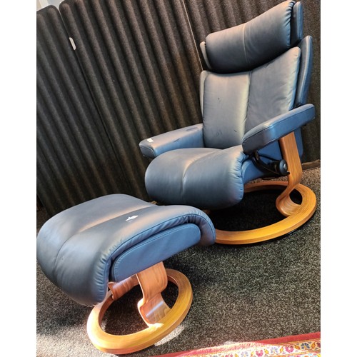 815 - Ekorness blue stressless leather relaxer chair together with matching pouffe.