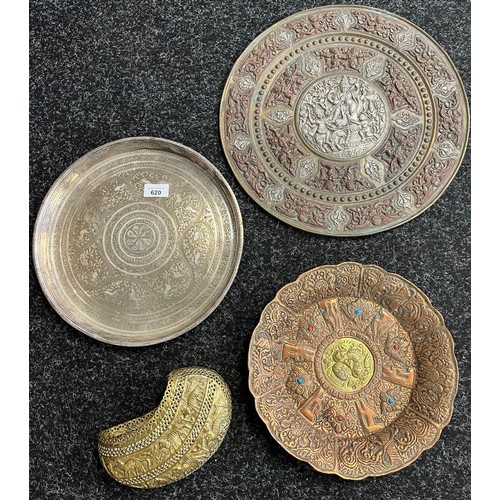 620 - A selection of antique Indian brass, copper and silver worked items. Includes three wall chargers an... 