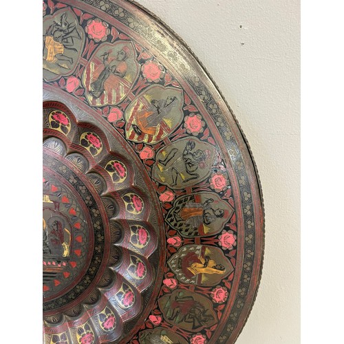 621 - Antique Indian brass and engraved wall charger/ table top. [59cm in diameter]