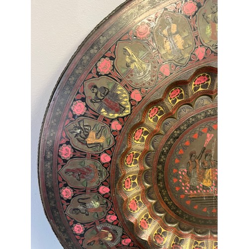 621 - Antique Indian brass and engraved wall charger/ table top. [59cm in diameter]