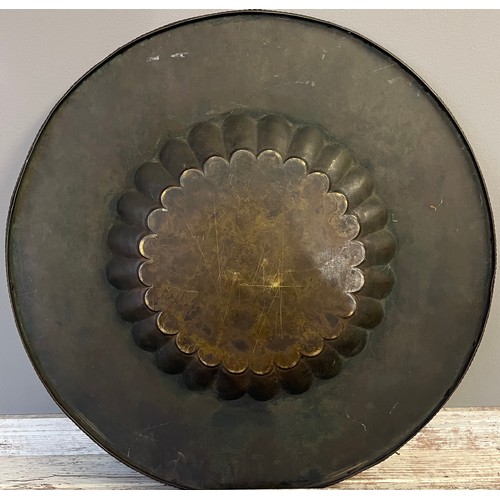 621 - Antique Indian brass and engraved wall charger/ table top. [59cm in diameter]