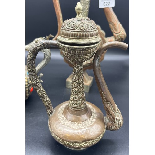 622 - A Lot of three Tibetan tea pots, made from copper, brass and possible silver mounts. [Tallest 35cm]