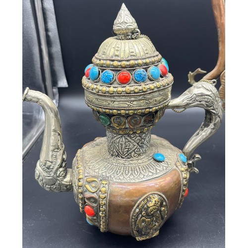 622 - A Lot of three Tibetan tea pots, made from copper, brass and possible silver mounts. [Tallest 35cm]