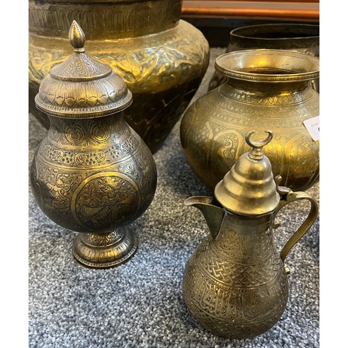 625 - A Selection of Indian brass wares to include planters, Urn vases with lids, Bulbous heavy worked vas... 