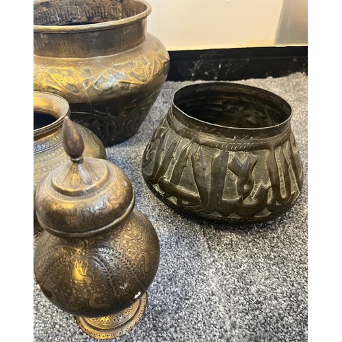 625 - A Selection of Indian brass wares to include planters, Urn vases with lids, Bulbous heavy worked vas... 