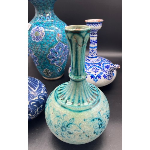 627 - Four pieces of Indian porcelain to include Multan bottle neck jug, Celadon glaze vase. and two other... 