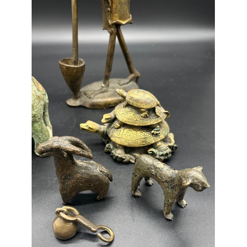 628 - A Lot of Asian Bronze and brass collectables. Includes antique bronze elephant, African bronze worke... 