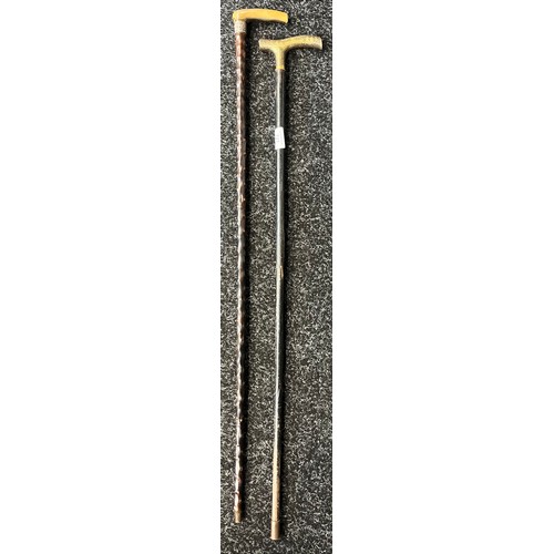 727 - Two vintage walking canes to include horn and silver top handle and brass engraved handle.