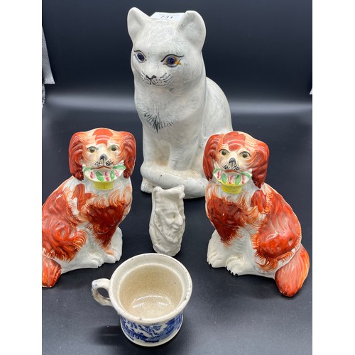 731 - A Lot of Porcelain ware to include glass eye cat, Staffordshire dog figures, small punch jug and blu... 