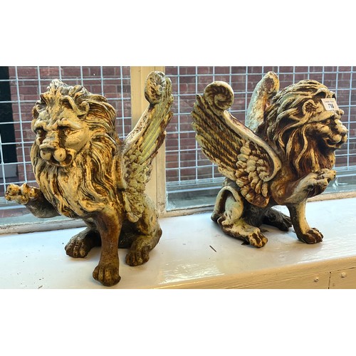 736 - A Pair of Heavy Antique Cast Iron winged lions seated. [30.5cm high]