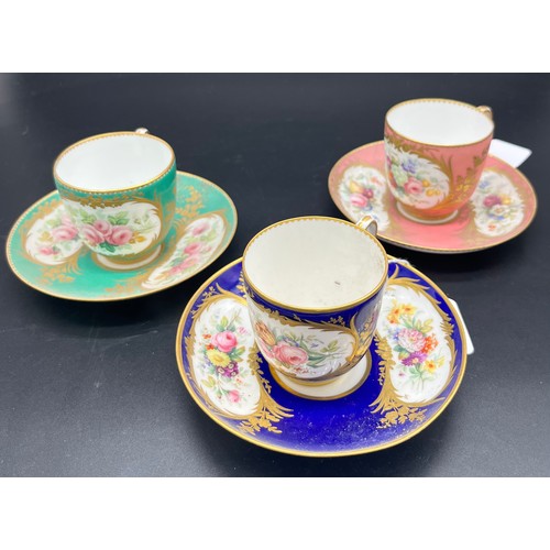 742 - A lot of three Antique hand painted cups and saucers. Detailed with gilt trims and bouquets of hand ... 