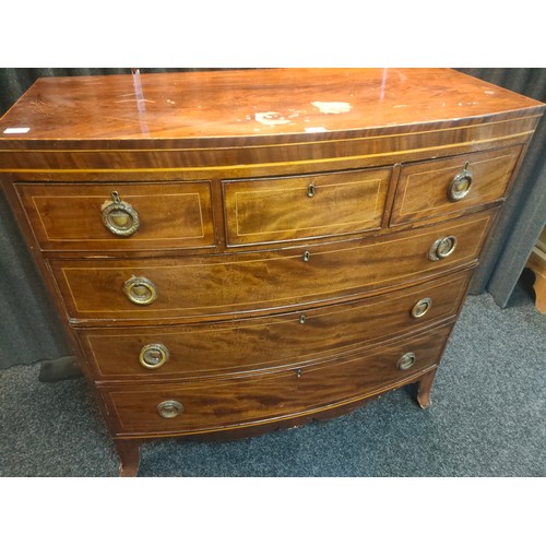 883 - A Georgian mahogany bow fronted 3 over 3 chest of drawers. [120x50x120cm]