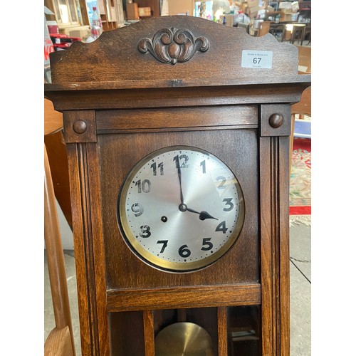 67 - Vintage wall clock. comes with key and pendulum.