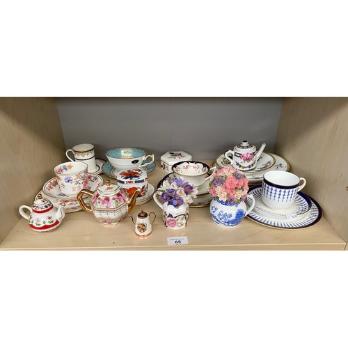 85 - Shelf of Wedgwood jasper ware dishes. Together with a shelf of trio's and small porcelain tea pots. ... 