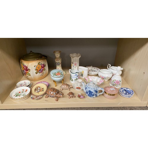 86 - Two shelves of collectable porcelain to include Austrian Bird panel urn vases, flower design biscuit... 