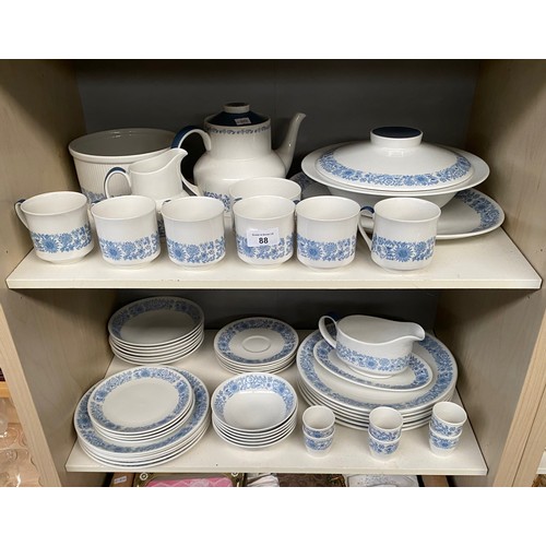 88 - Two shelves of Royal Doulton 'Cranbourne' dinner and tea service. Includes tureens and platters.