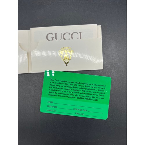 17 - Vintage Gucci Quartz gold plated wrist watch, comes with boxes and booklet.