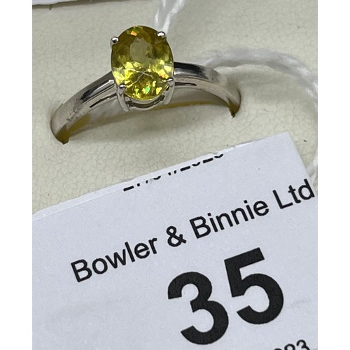 35 - 10ct white gold ladies ring set with a yellow glass cut stone. [Ring size P] [1.93grams]