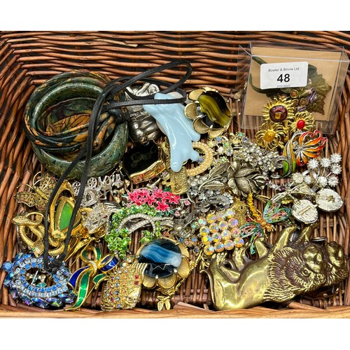 48 - Basket of costume jewellery to include two baby rattles, Various brooches to include dragonfly brooc... 