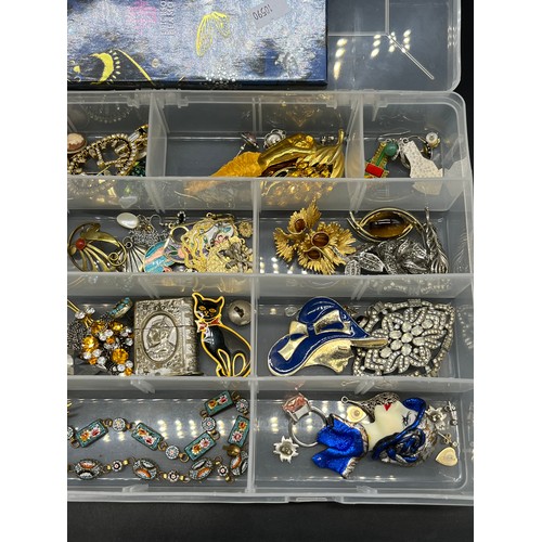 49 - A Plastic box containing a quantity of costume jewellery to include brooches, Millefiori bracelets, ... 