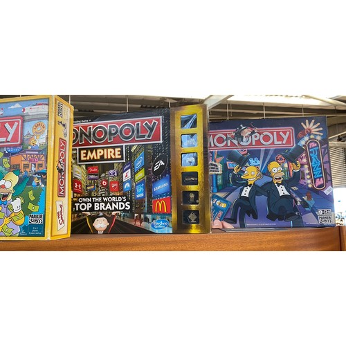 80 - A Large collection of boxed Monopoly includes Simpsons monopoly etc