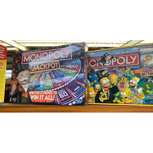 80 - A Large collection of boxed Monopoly includes Simpsons monopoly etc