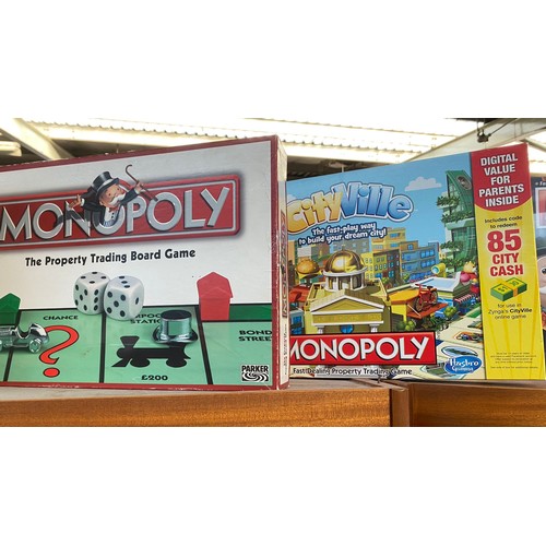 80 - A Large collection of boxed Monopoly includes Simpsons monopoly etc