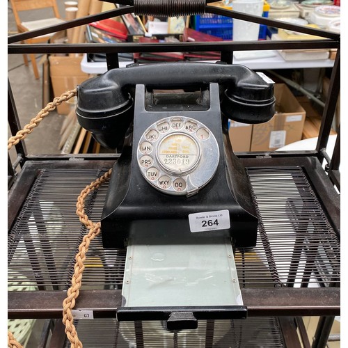 264 - A Vintage black dial phone with pull out card deck.