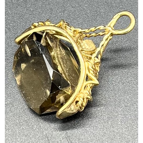 43 - 9ct gold fob fitted with a smokey quartz stone