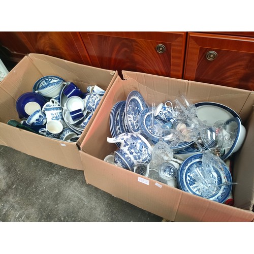 496A - Two boxes of blue and white porcelain wares to include make Churchill and Willow pattern.