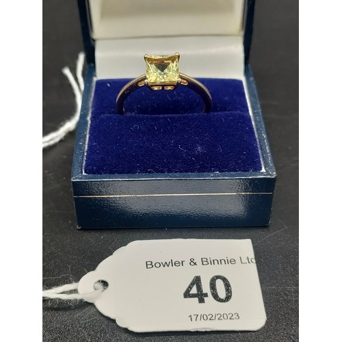 40 - 10ct yellow gold ladies ring set with a green topaz stone. [Ring size R] [2.46Grams]