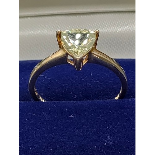 55 - 10ct yellow gold ladies ring set with a single green topaz stone. [Ring size P] [1.89Grams]