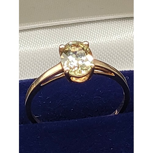 56 - 10ct yellow gold ladies ring set with a single green topaz [Ring size Q] [1.66Grams]