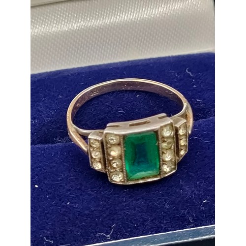 23 - Art Deco 9ct gold ring set with a green cut stone off set by white stone shoulders. [All possibly gl... 