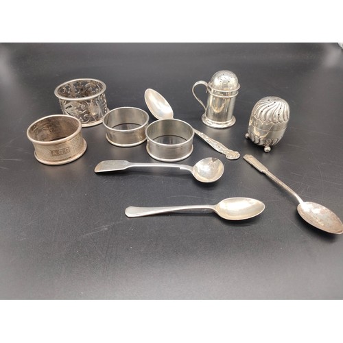 27 - A Collection of silver marked items to include four napkin rings, Two silver pepper pots, Victorian ... 