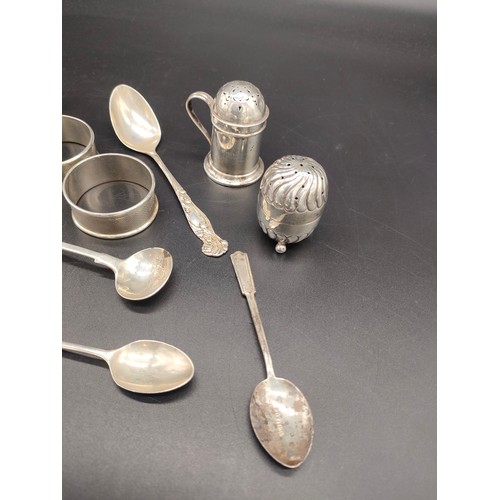 27 - A Collection of silver marked items to include four napkin rings, Two silver pepper pots, Victorian ... 