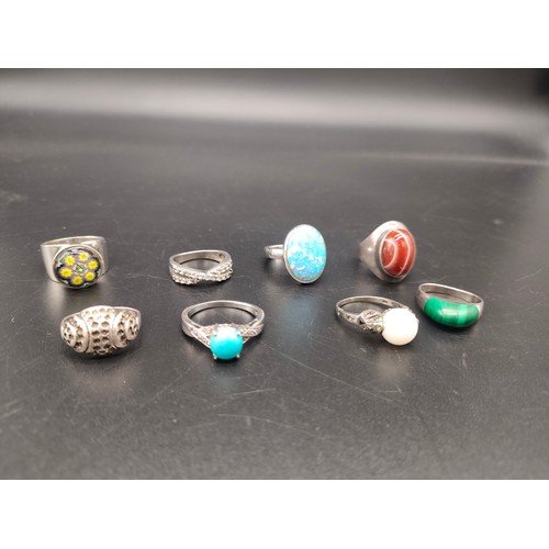 49 - A Lot of eight various silver 925 rings set with various stones, Includes Opal, Malachite, Red Agate... 