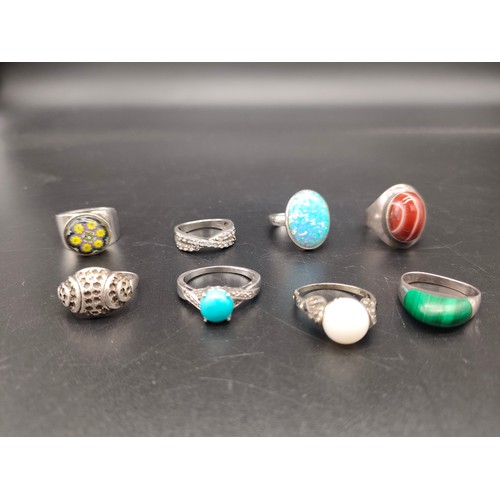 49 - A Lot of eight various silver 925 rings set with various stones, Includes Opal, Malachite, Red Agate... 