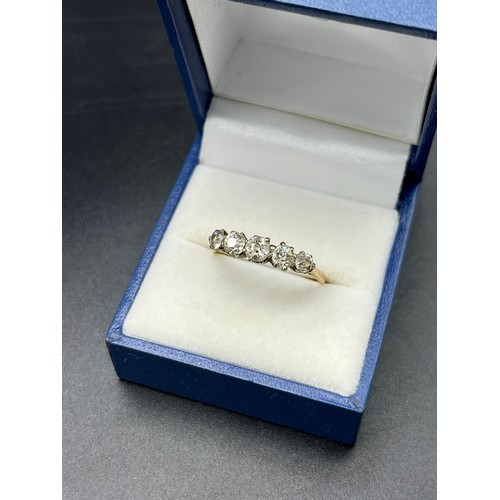 502 - 18ct yellow gold and five diamond stone set ring. [2.74grams] [Approx. 0.60cts diamonds] [Ring size ... 