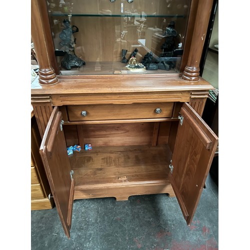 133 - Antique style column display cabinet.