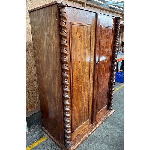 162 - 19th century burr walnut wardrobe, the two long doors opening to interior storage, flanked by barley... 