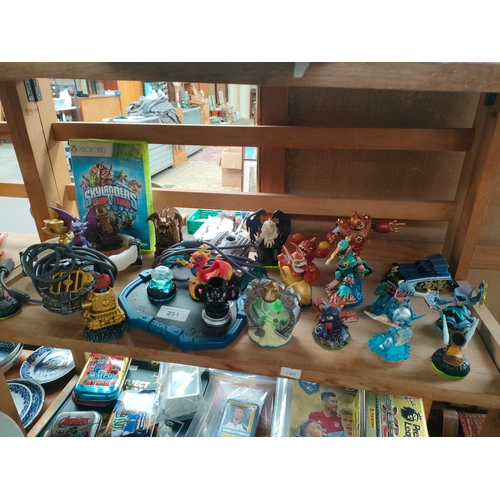 251 - Shelf of Skylanders figures