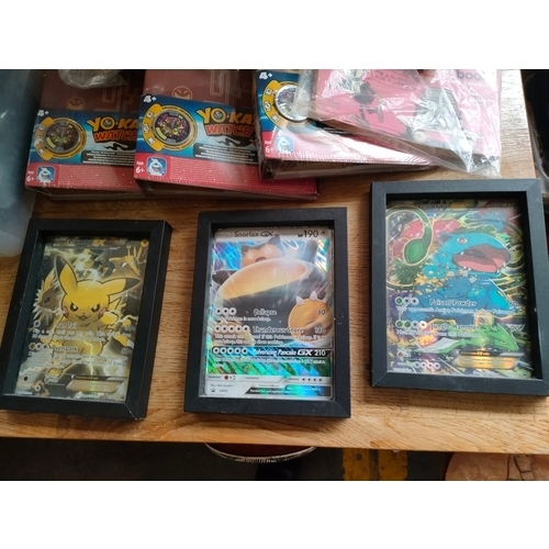 254 - Box of Andy capp books , Pokémon 2 framed large cards along with new yokai watch folders