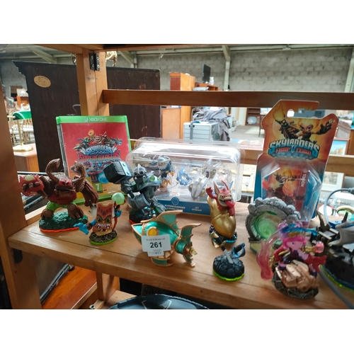 261 - Shelf of Xbox 360 Skylanders.