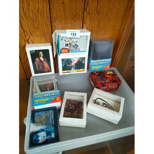 125 - A Large collection of trading cards to include star wars, Lord of the rings etc