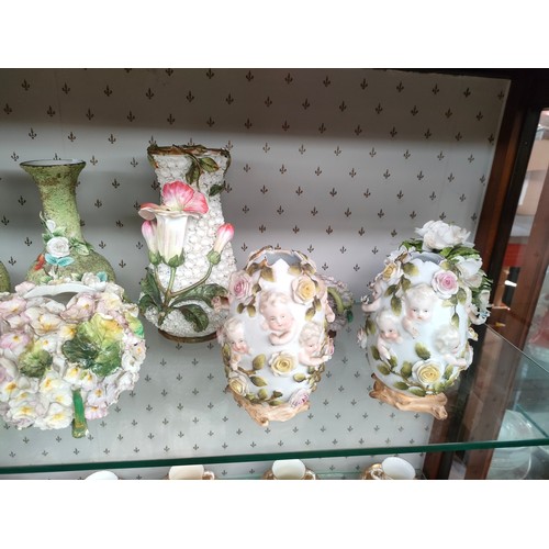 111 - A Large shelf of Victorian porcelain includes Meissen style bottle jars, vases etc