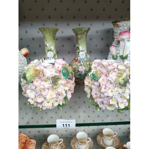 111 - A Large shelf of Victorian porcelain includes Meissen style bottle jars, vases etc