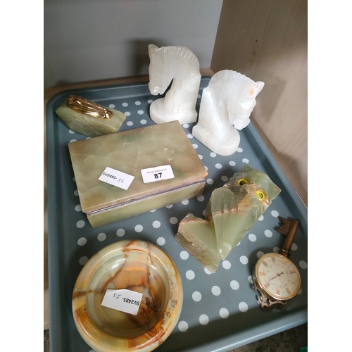 87 - A Tray of collectables includes onyx table lighter, jewellery box and horse head bookends